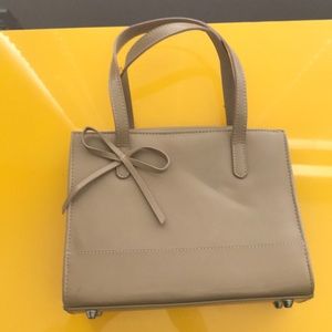 Small tan colored handbag
